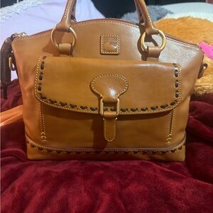 Dooney and Bourke natural Florentine pocket satchel. Great condition.